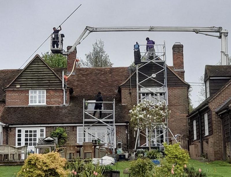 The Roof Moss Cleaners using cherry picker and scaffolding to clean roof safely and professionally in Highworth, Wiltshire